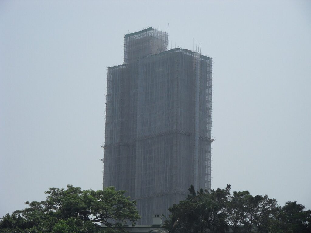 Bamboo scaffolding on a Hong Kong building, photographed in 2010; context for Hong Kong bid-rigging.