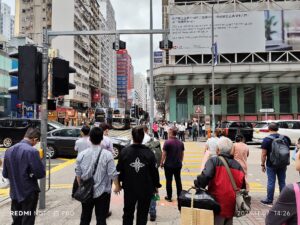 Cars, buses and pedestrians at Nathan Road and Argyle Street in Mong Kok in November 2025